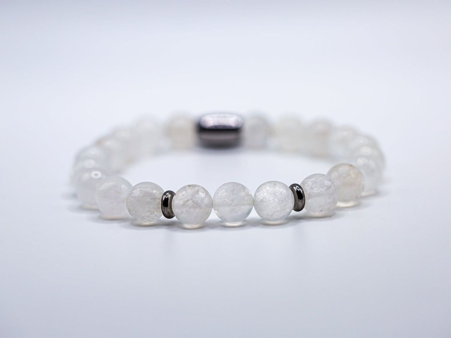 Ashur Designs 8mm natural moonstone gemstone bracelet. White background with rule of three beads.